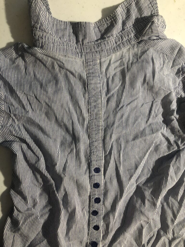 The thread bare yoke of a shirt